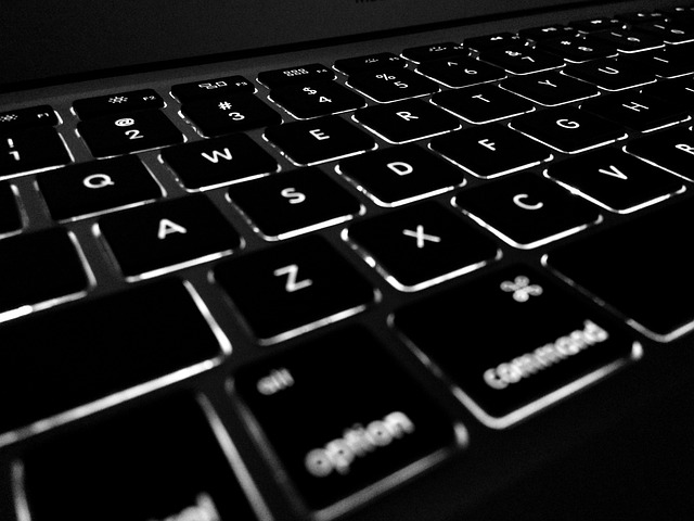 Person typing on a computer keyboard