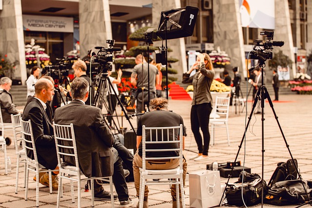 Reporters interviewing a person